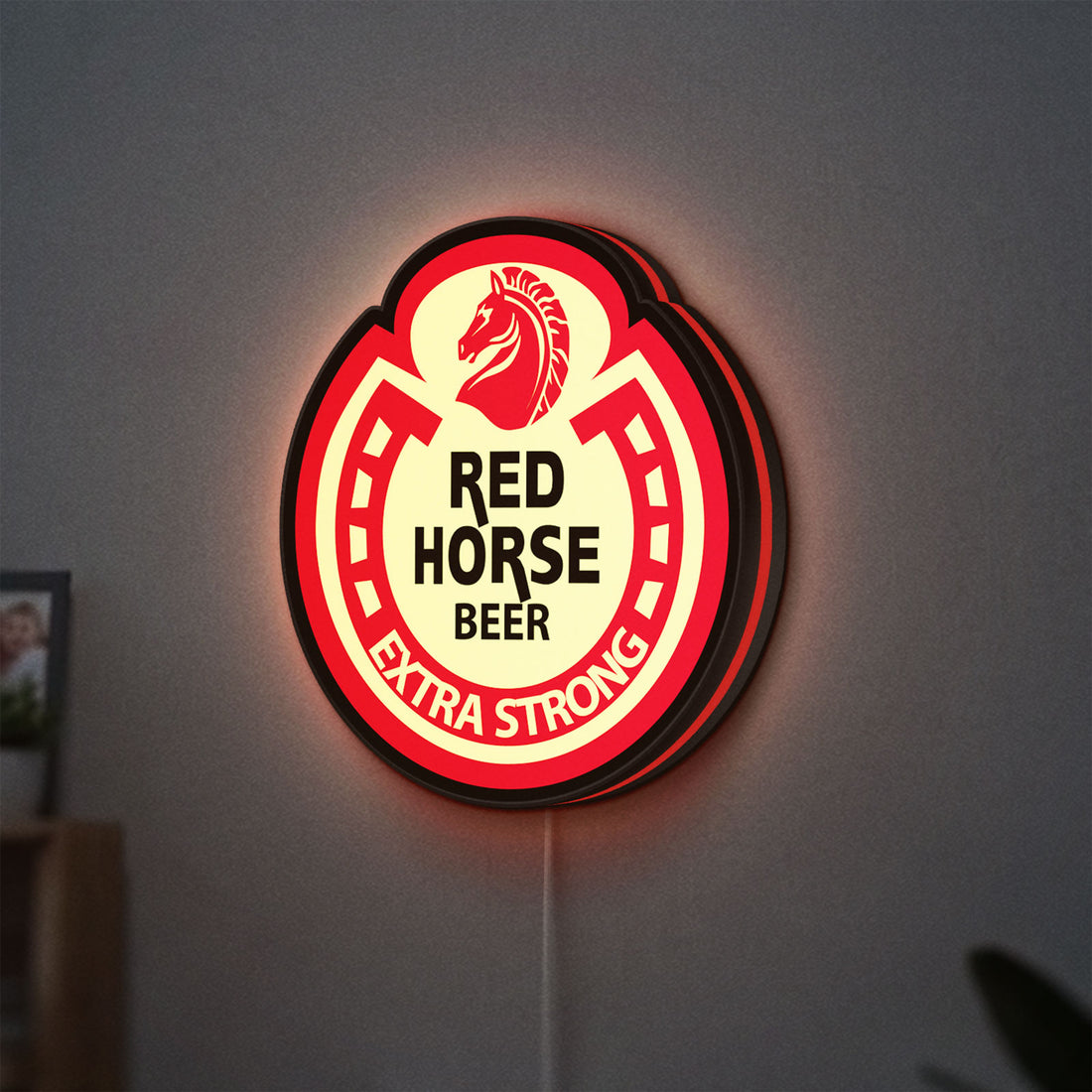 Red Horse Beer LED lightbox hanging on a wall with red glow