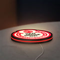 Red Horse Beer LED lightbox lying flat on a desk with red glow