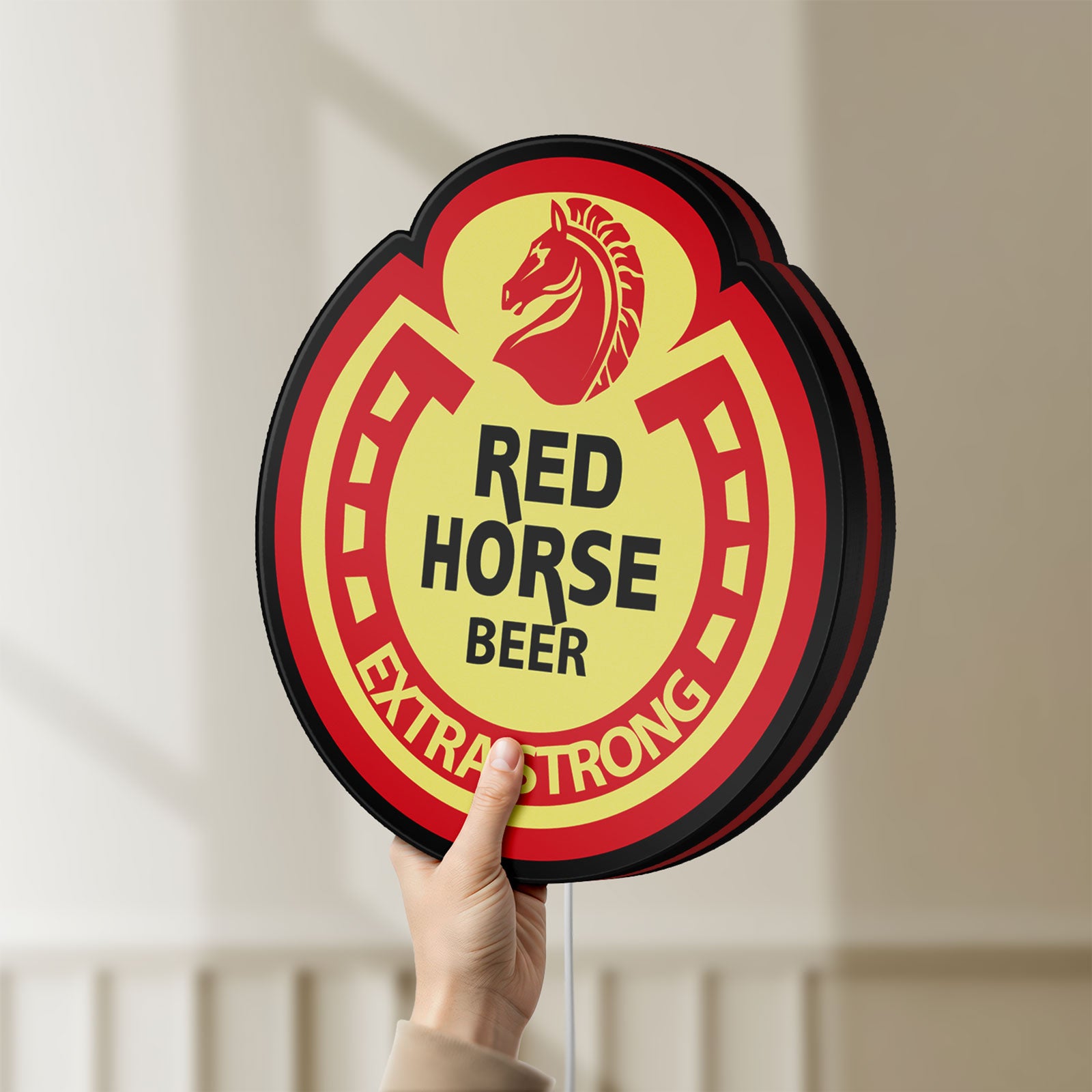Unlit Red Horse Beer LED lightbox held by hand to show size and details