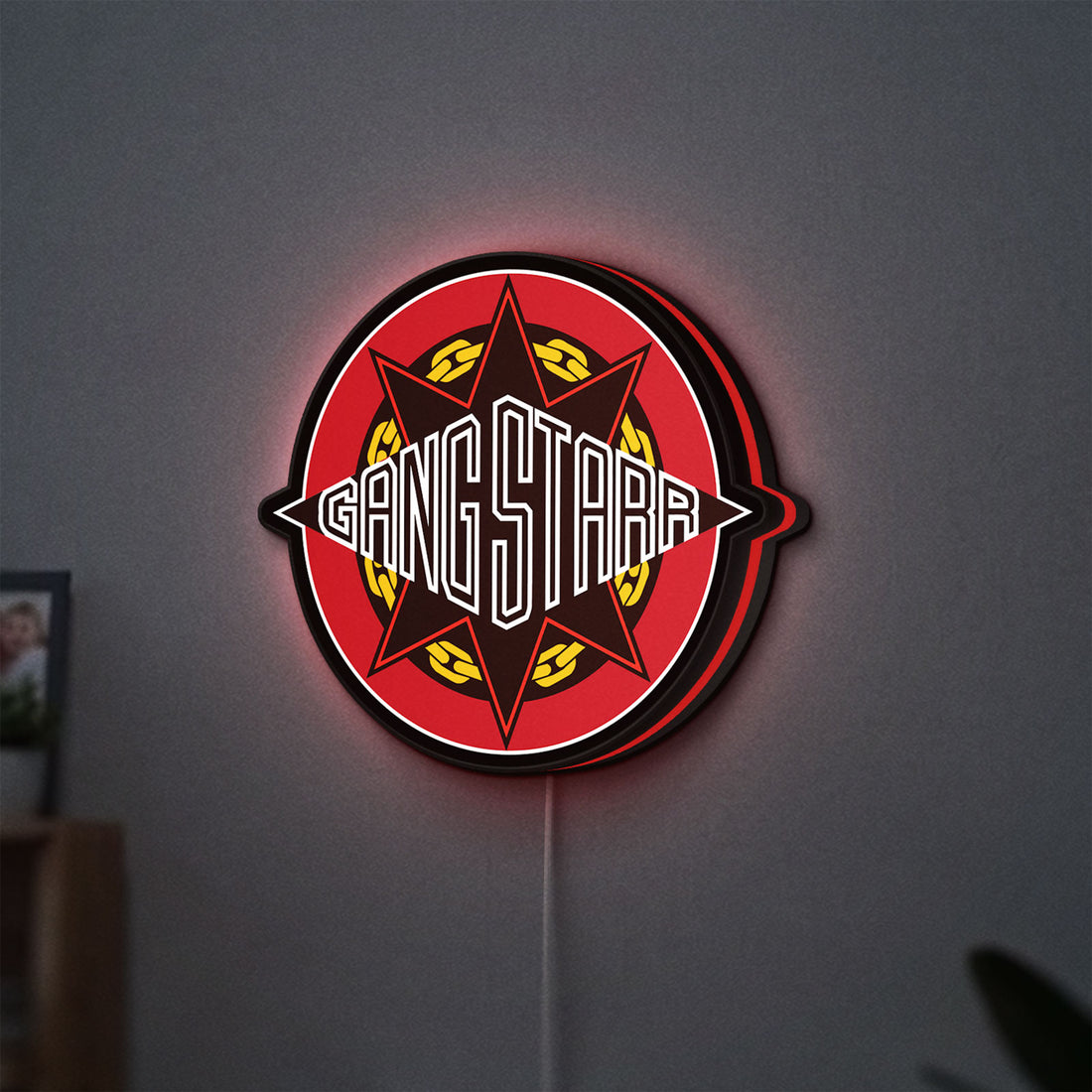 Gang Starr LED lightbox hanging on a wall with red glow