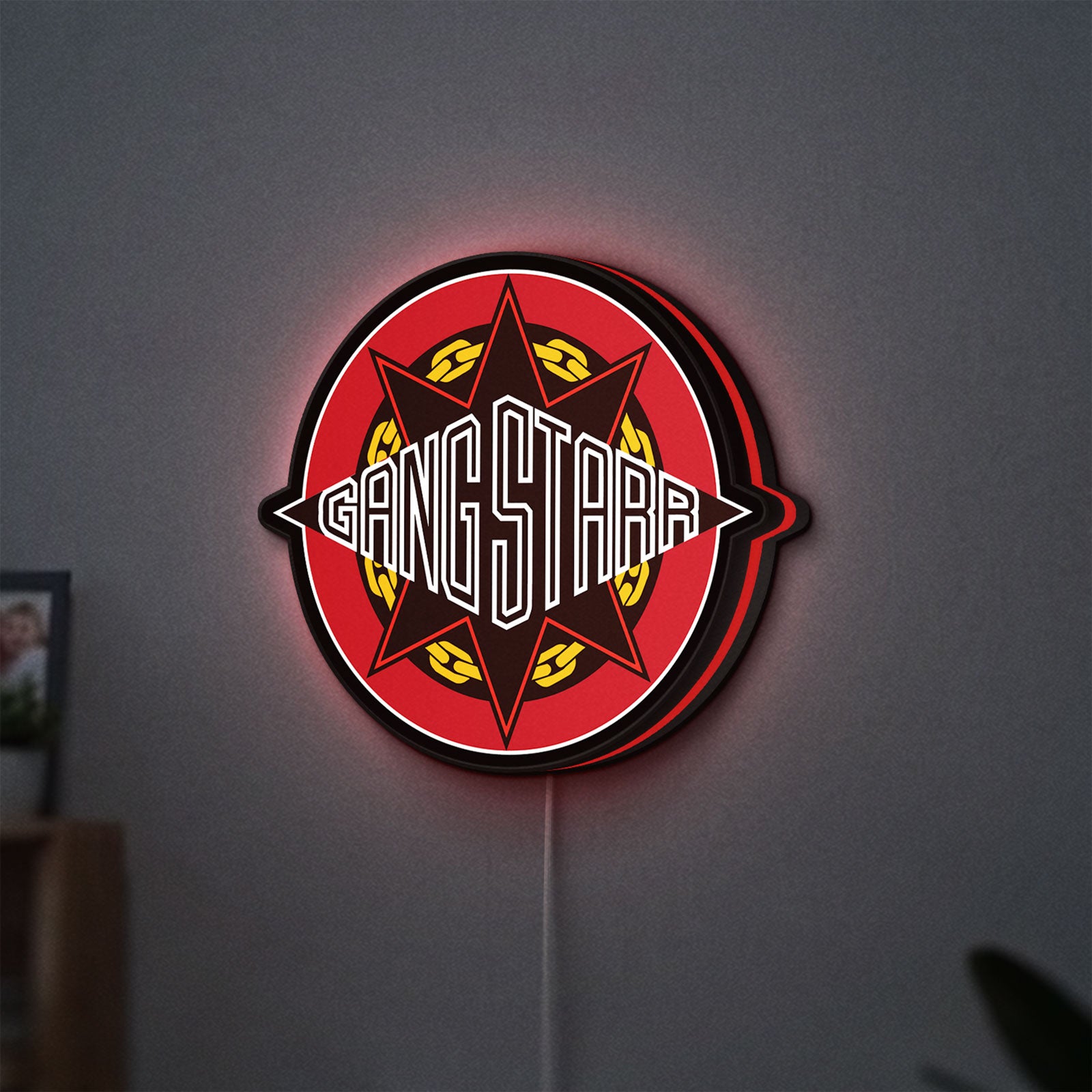 Gang Starr LED lightbox hanging on a wall with red glow