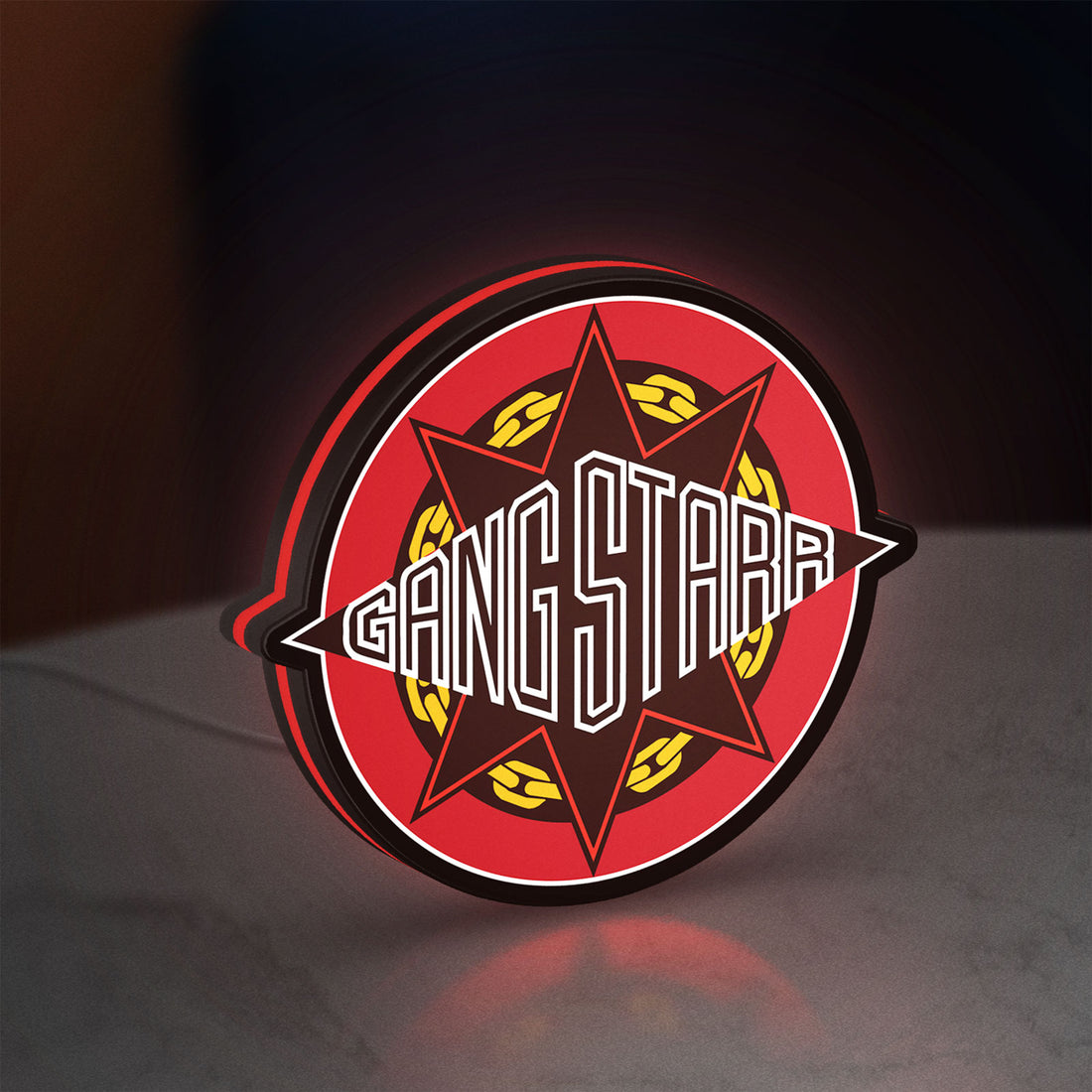 Gang Starr LED lightbox hanging on a wall with red glow