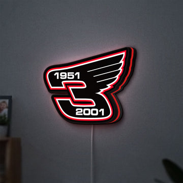 Dale Earnhardt Wings LED lightbox hanging on a wall with red glow