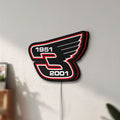 Unlit Dale Earnhardt Wings LED lightbox mounted on a wall in daylight