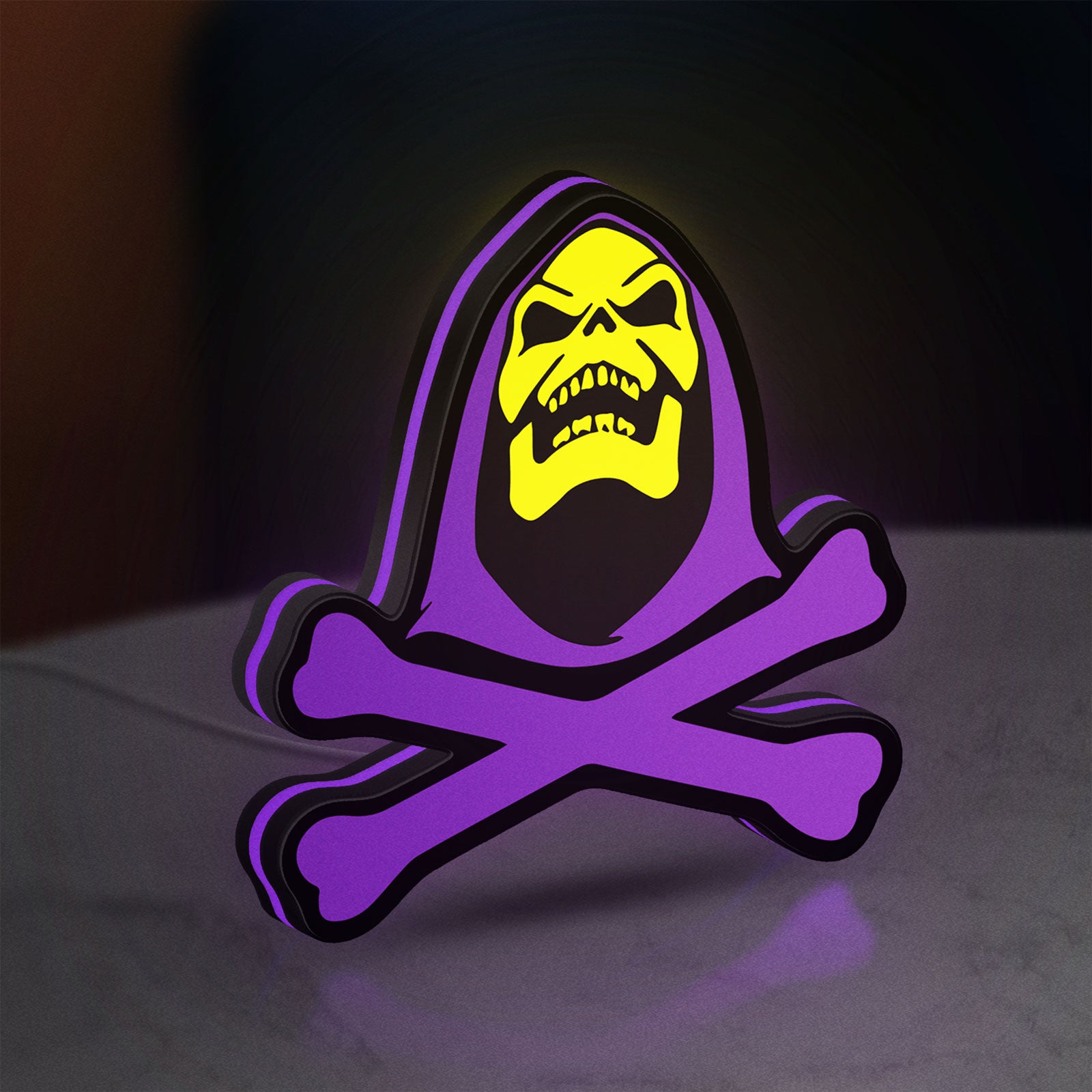 Skeletor LED lightbox standing on a desk from an angled side view with purple glow
