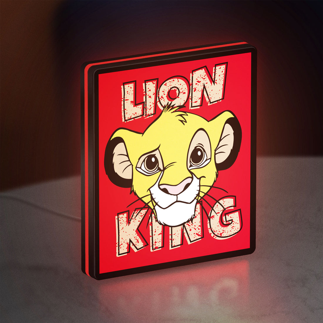 Simba Lion King LED lightbox hanging on a wall with red glow