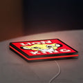 Simba Lion King LED lightbox lying flat on a desk with red glow