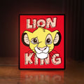 Front view of Simba Lion King LED lightbox sign glowing on a wooden desk