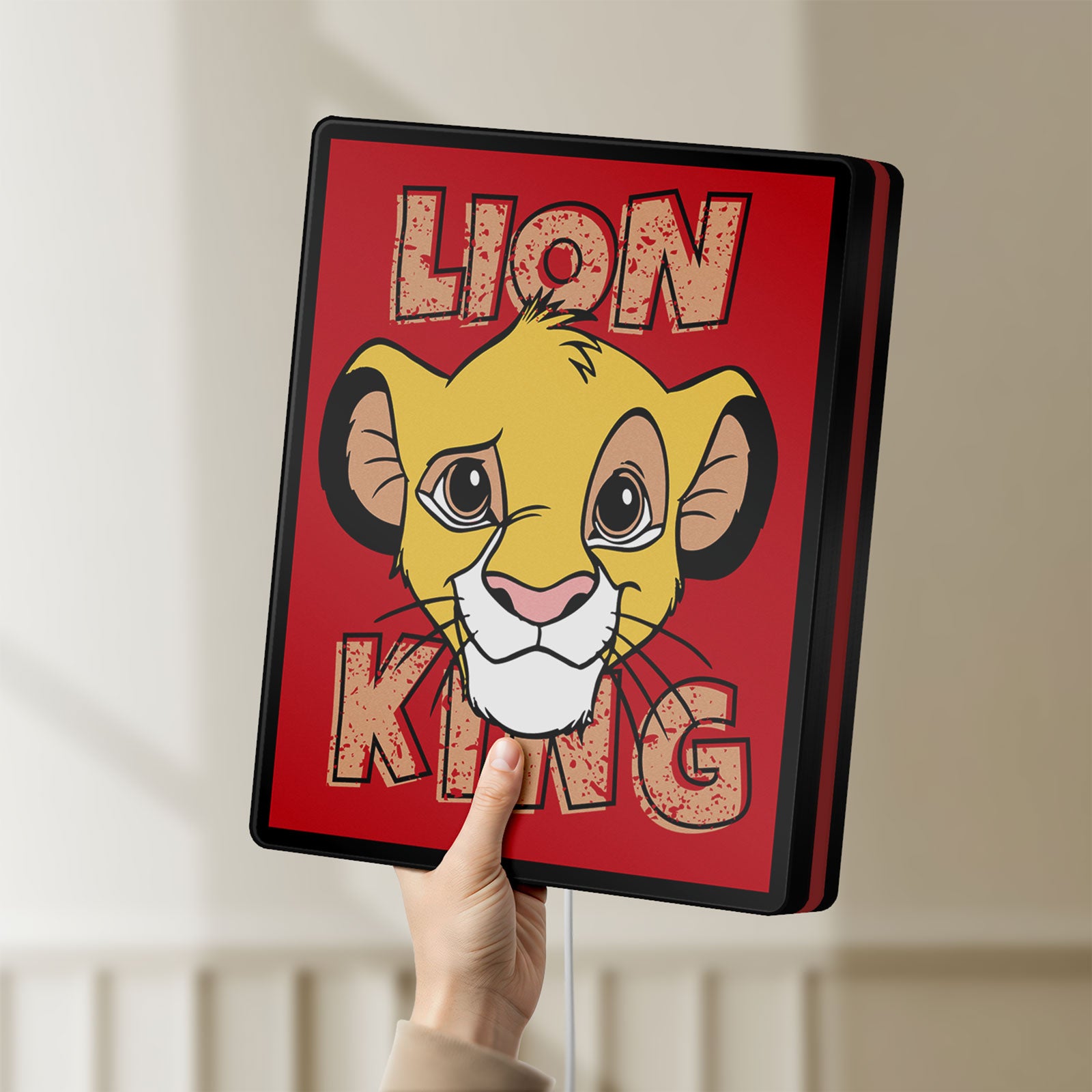 Unlit Simba Lion King LED lightbox held by hand to show size and details