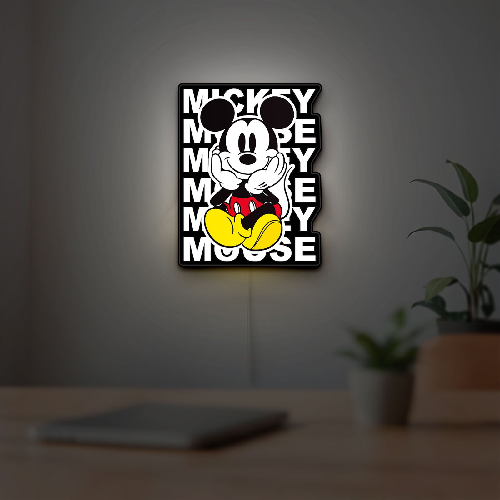 Mickey Mouse LED lightbox hanging on a room wall with soft white light