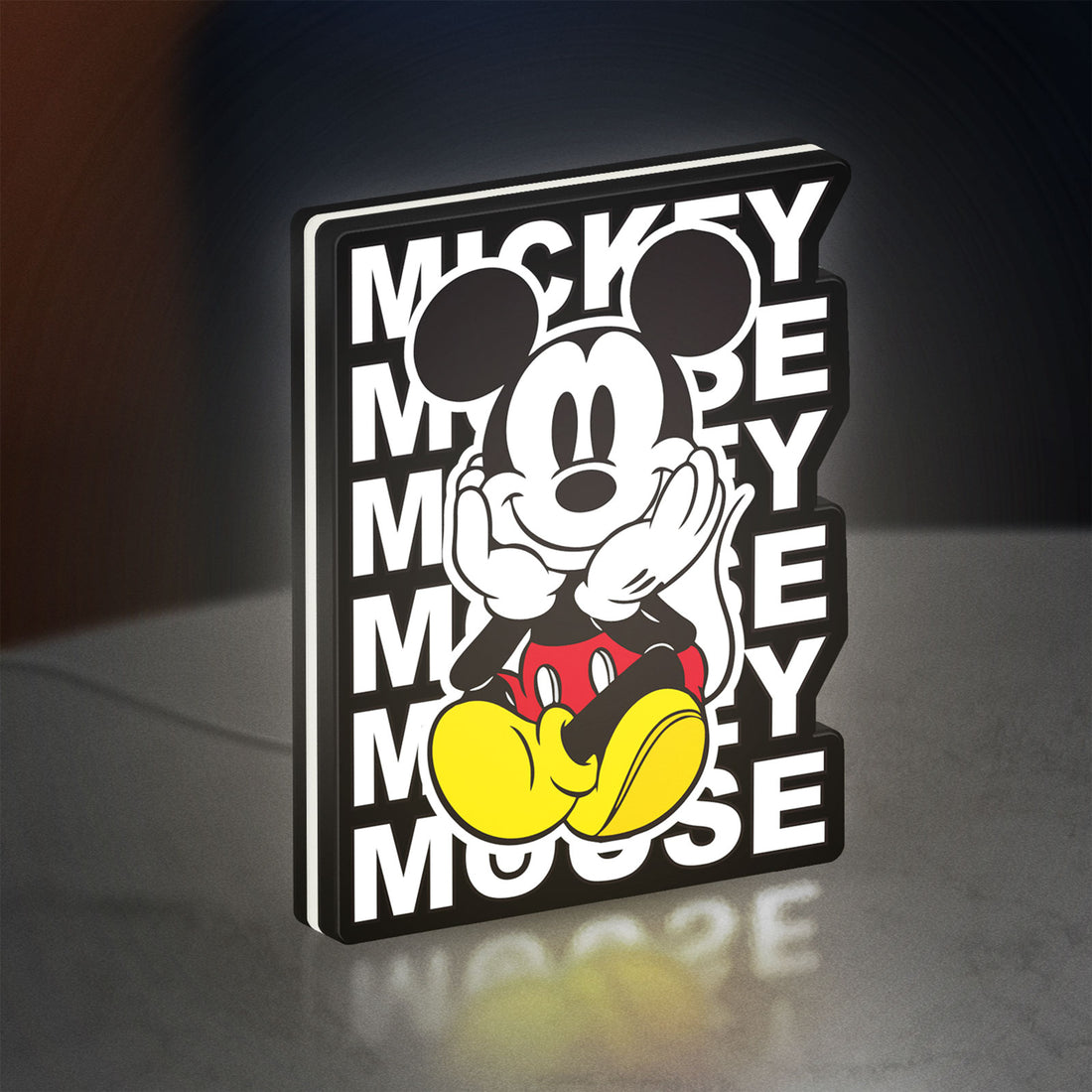 Mickey Mouse LED lightbox hanging on a wall with white glow