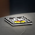 Mickey Mouse LED lightbox lying flat on a desk with white glow