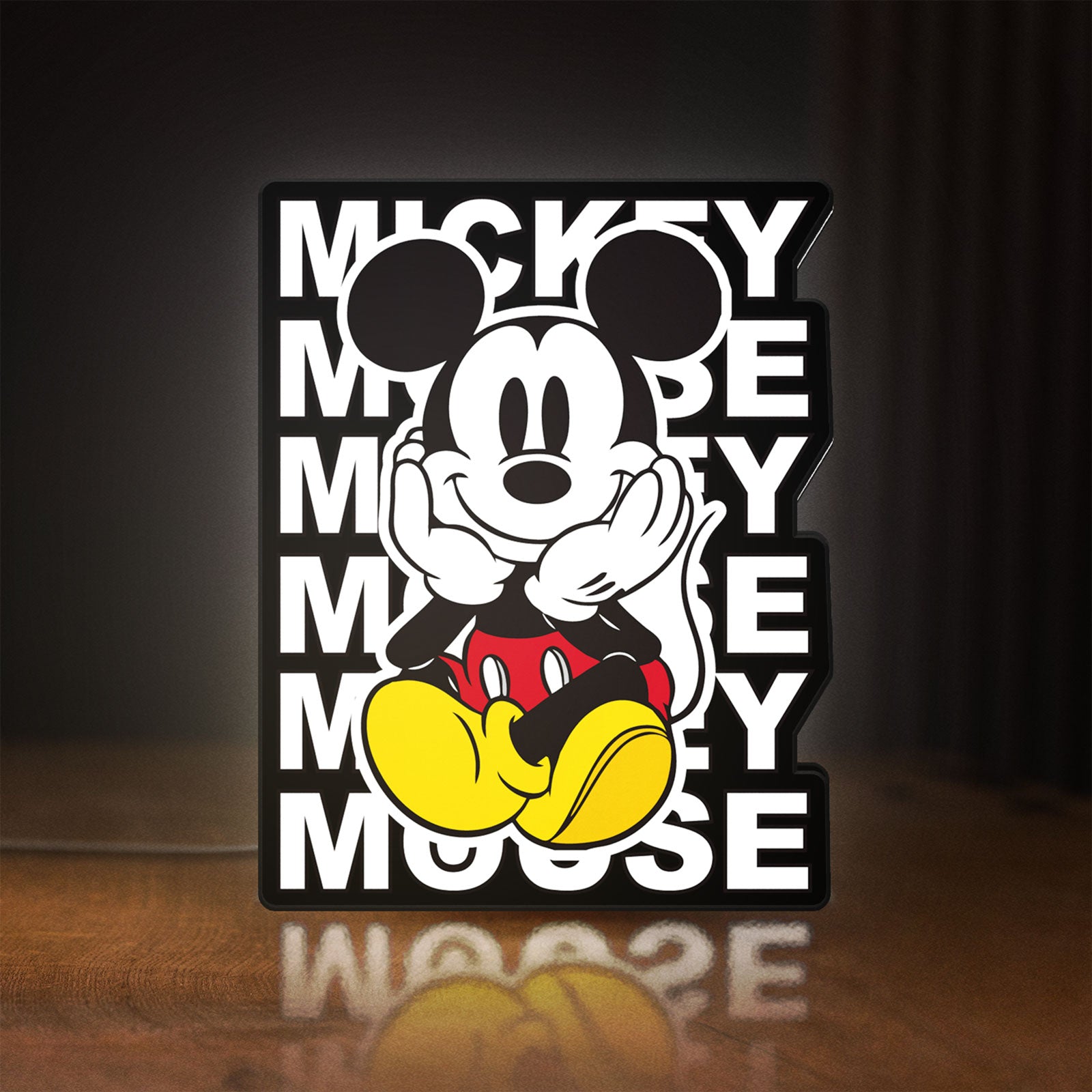 Front view of Mickey Mouse LED lightbox sign glowing on a wooden desk
