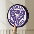 Unlit Dodgeball Globo Gym Purple Cobras LED lightbox held by hand to show size and details