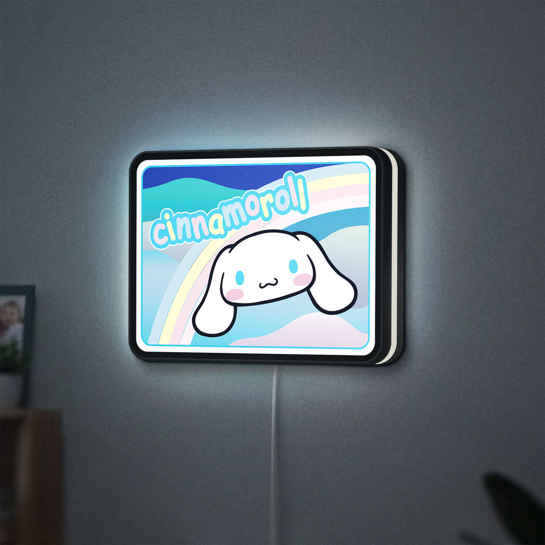 Cinnamoroll LED lightbox hanging on a wall with white glow