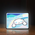 Front view of Cinnamoroll LED lightbox sign glowing on a wooden desk
