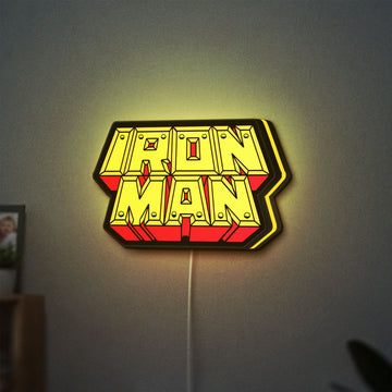 Iron Man LED lightbox hanging on a wall with yellow glow