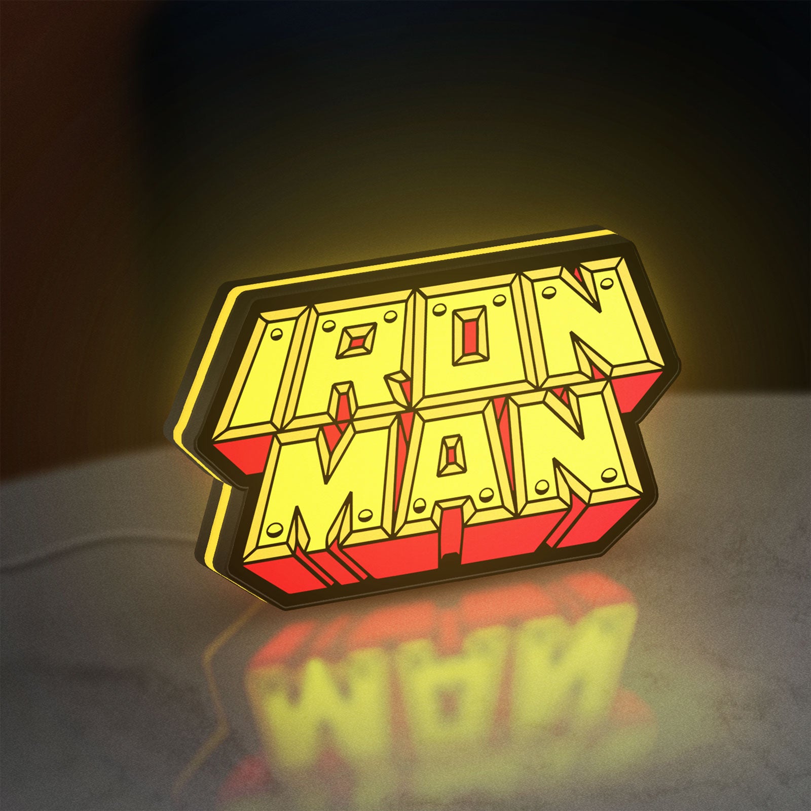 Iron Man LED lightbox standing on a desk from an angled side view with yellow glow