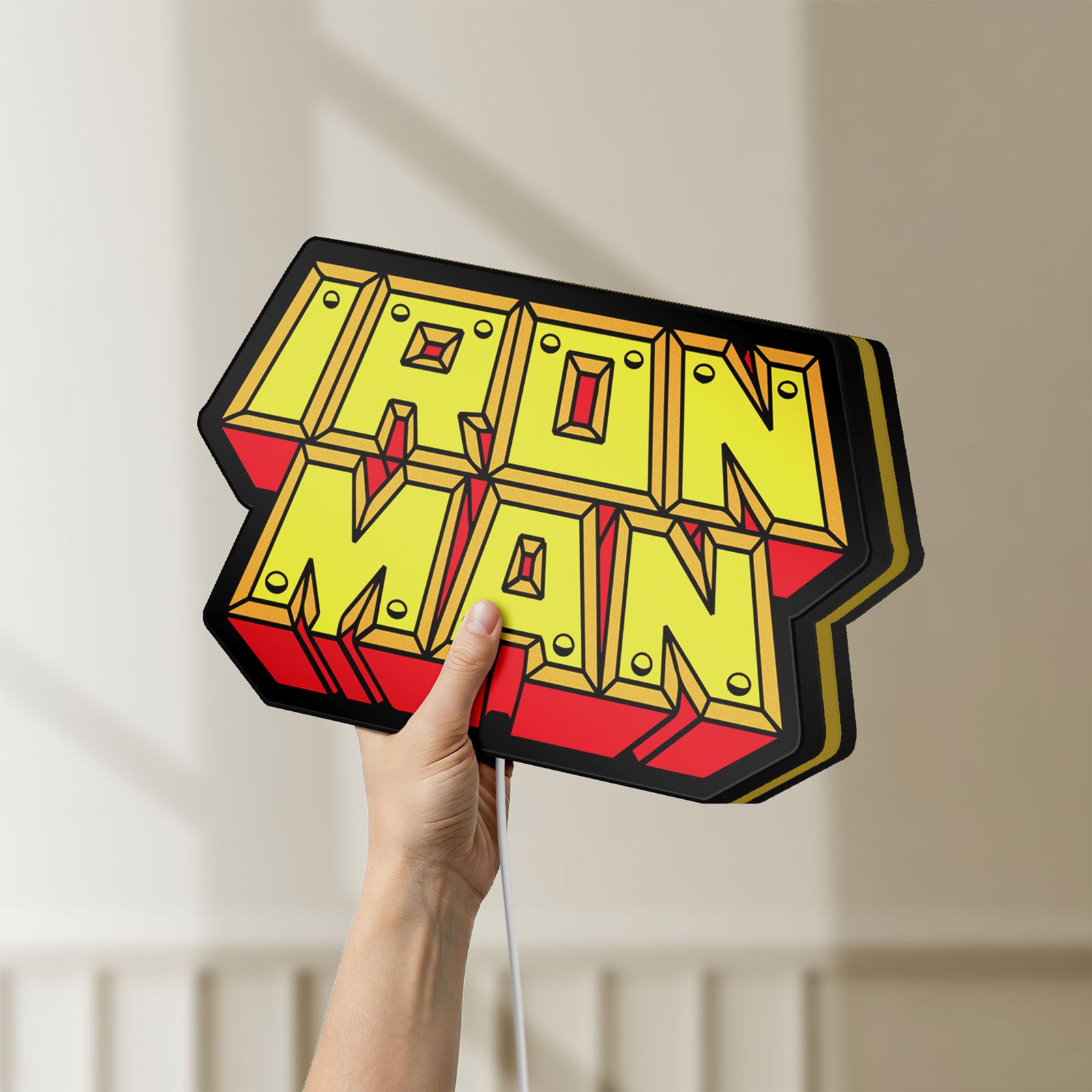 Unlit Iron Man LED lightbox held by hand to show size and details