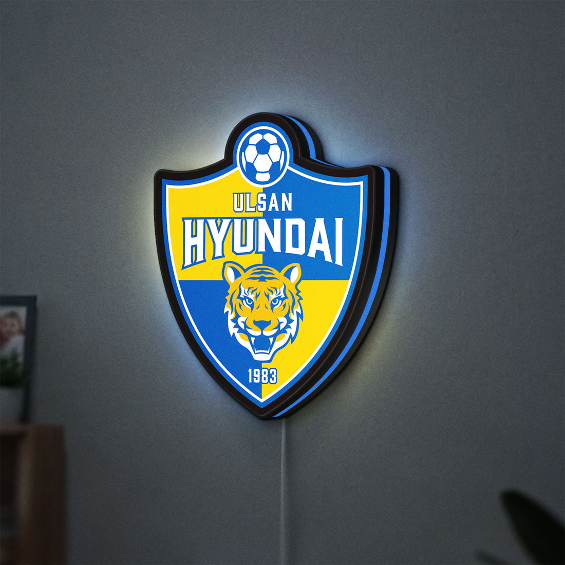 K-League Ulsan Hyundai LED lightbox hanging on a wall with blue glow