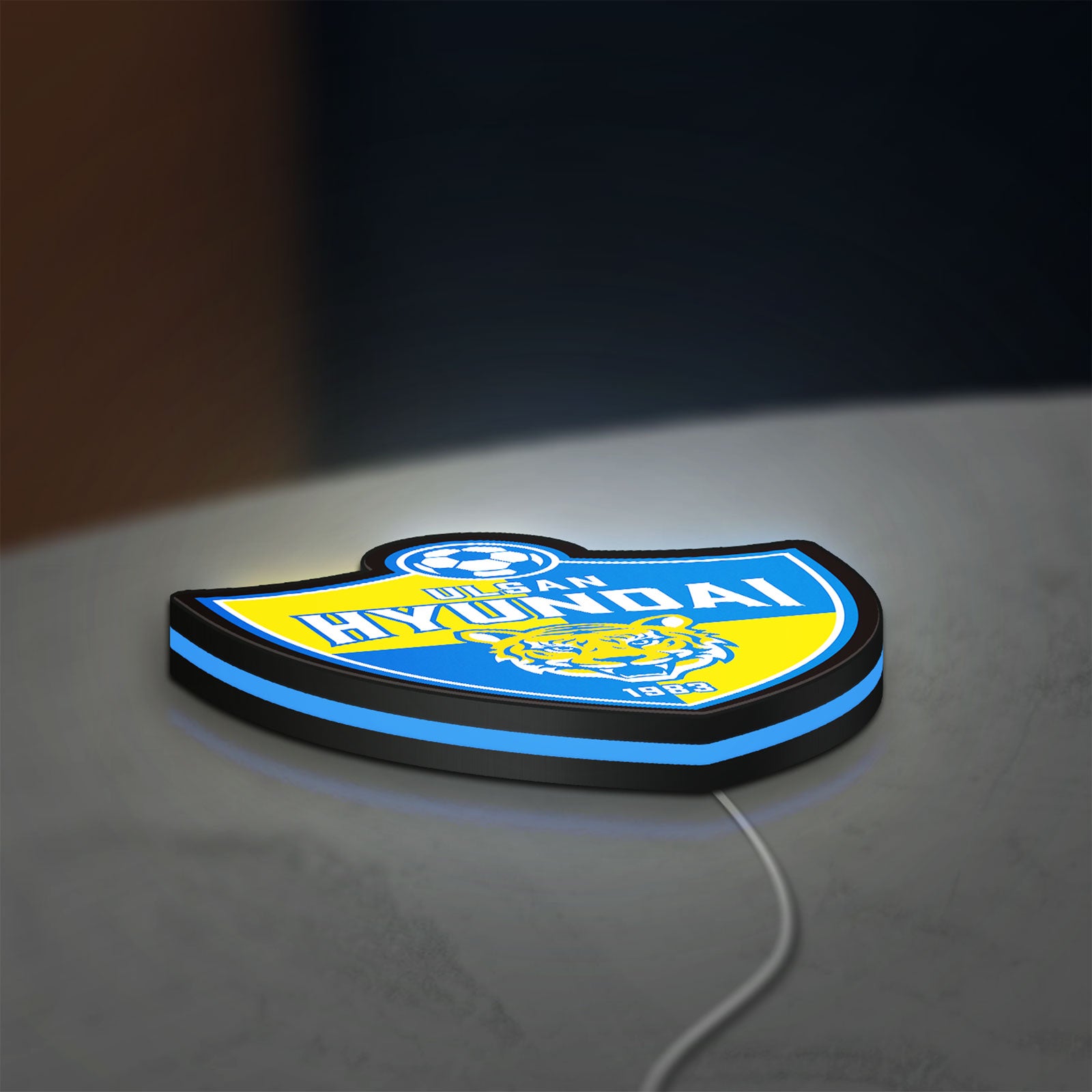 K-League Ulsan Hyundai LED lightbox lying flat on a desk with blue glow