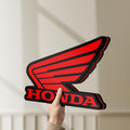 Unlit Honda LED lightbox held by hand to show size and details