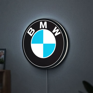 BMW LED lightbox hanging on a wall with white glow