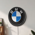 Unlit BMW LED lightbox mounted on a wall in daylight