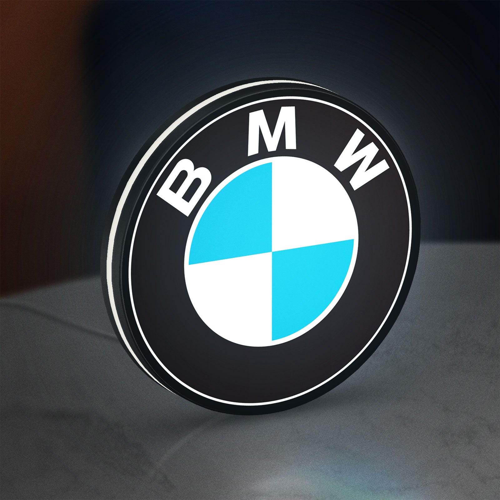BMW LED lightbox standing on a desk from an angled side view with white glow