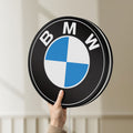 Unlit BMW LED lightbox held by hand to show size and details
