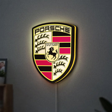 Porsche LED lightbox hanging on a wall with yellow glow