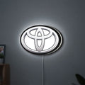 Toyota LED lightbox hanging on a wall with white glow