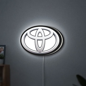 Toyota LED lightbox hanging on a wall with white glow