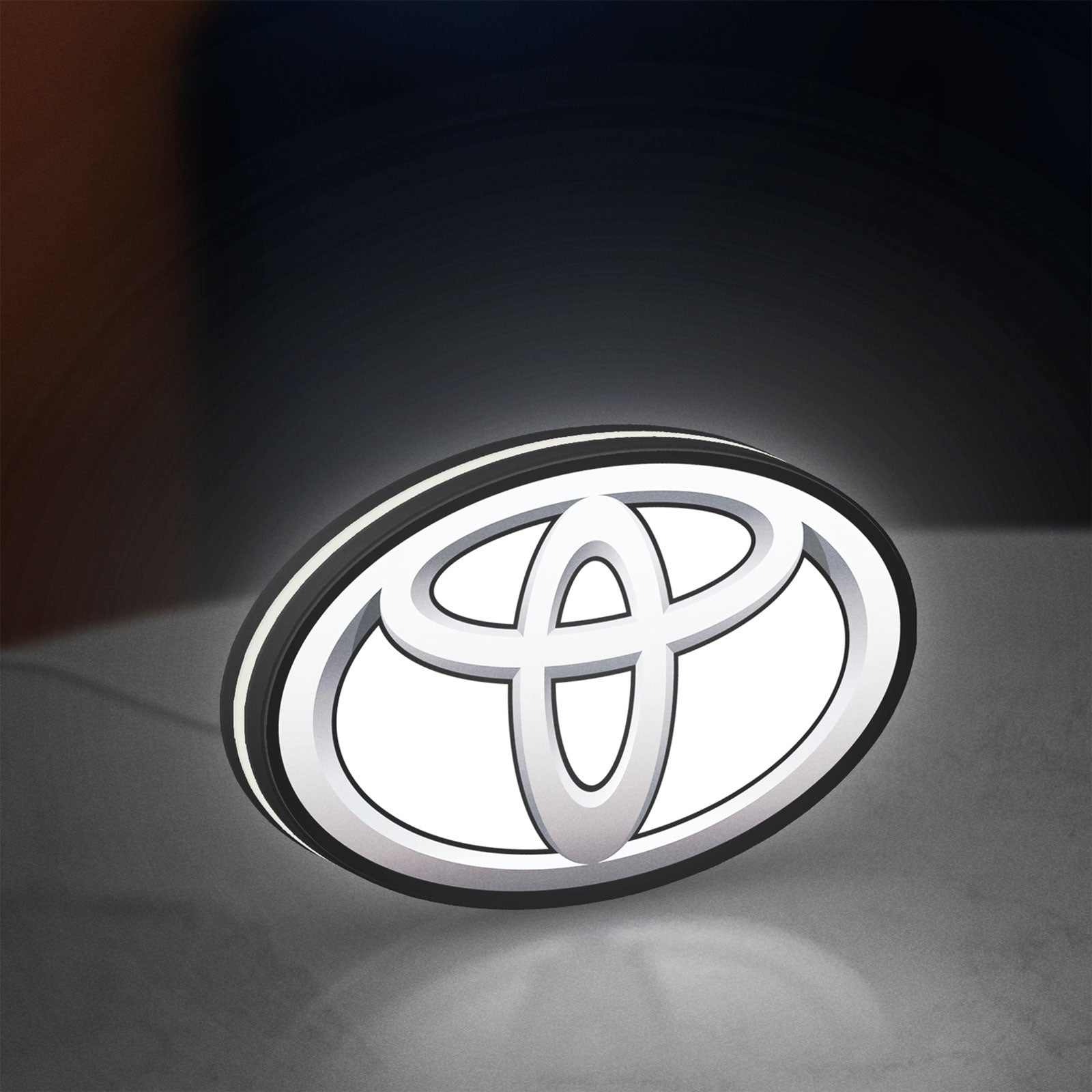 Toyota LED lightbox standing on a desk from an angled side view with white glow