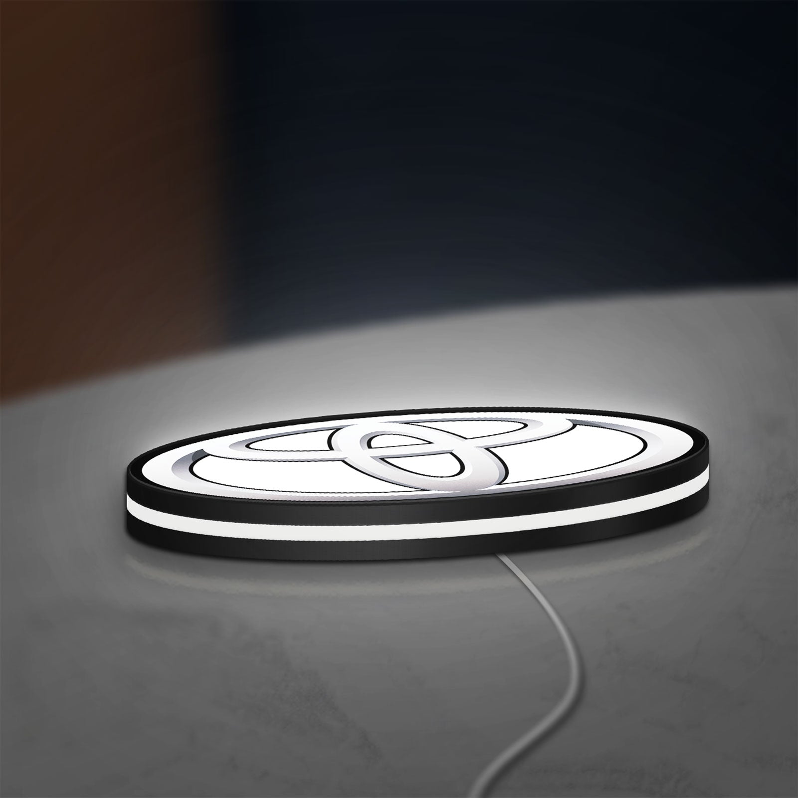 Toyota LED lightbox lying flat on a desk with white glow