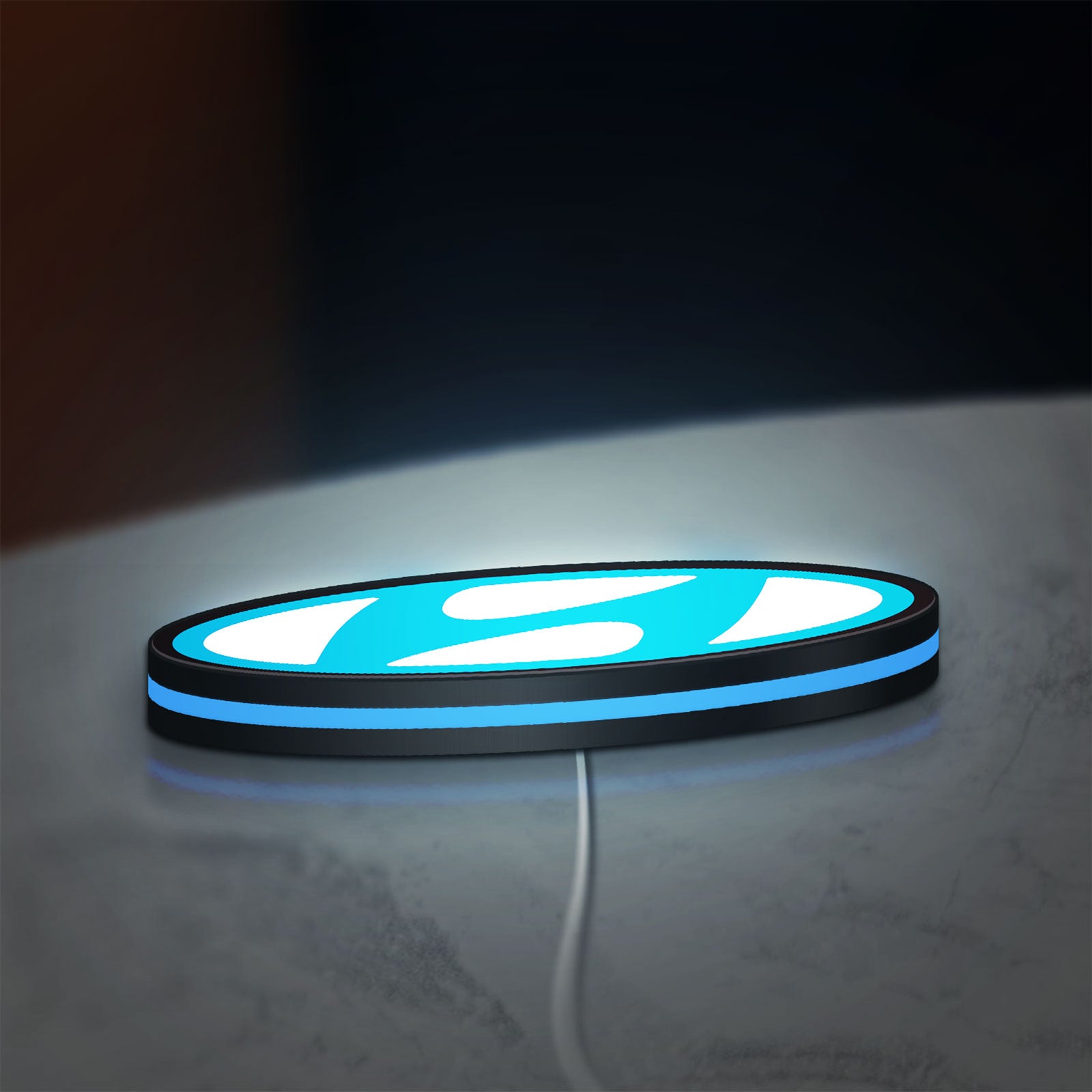 Hyundai LED lightbox lying flat on a desk with blue glow