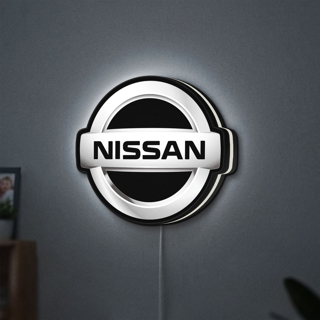 Nissan LED lightbox hanging on a wall with white glow
