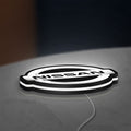 Nissan LED lightbox lying flat on a desk with white glow
