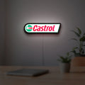 Castrol LED lightbox hanging on a room wall with soft white light