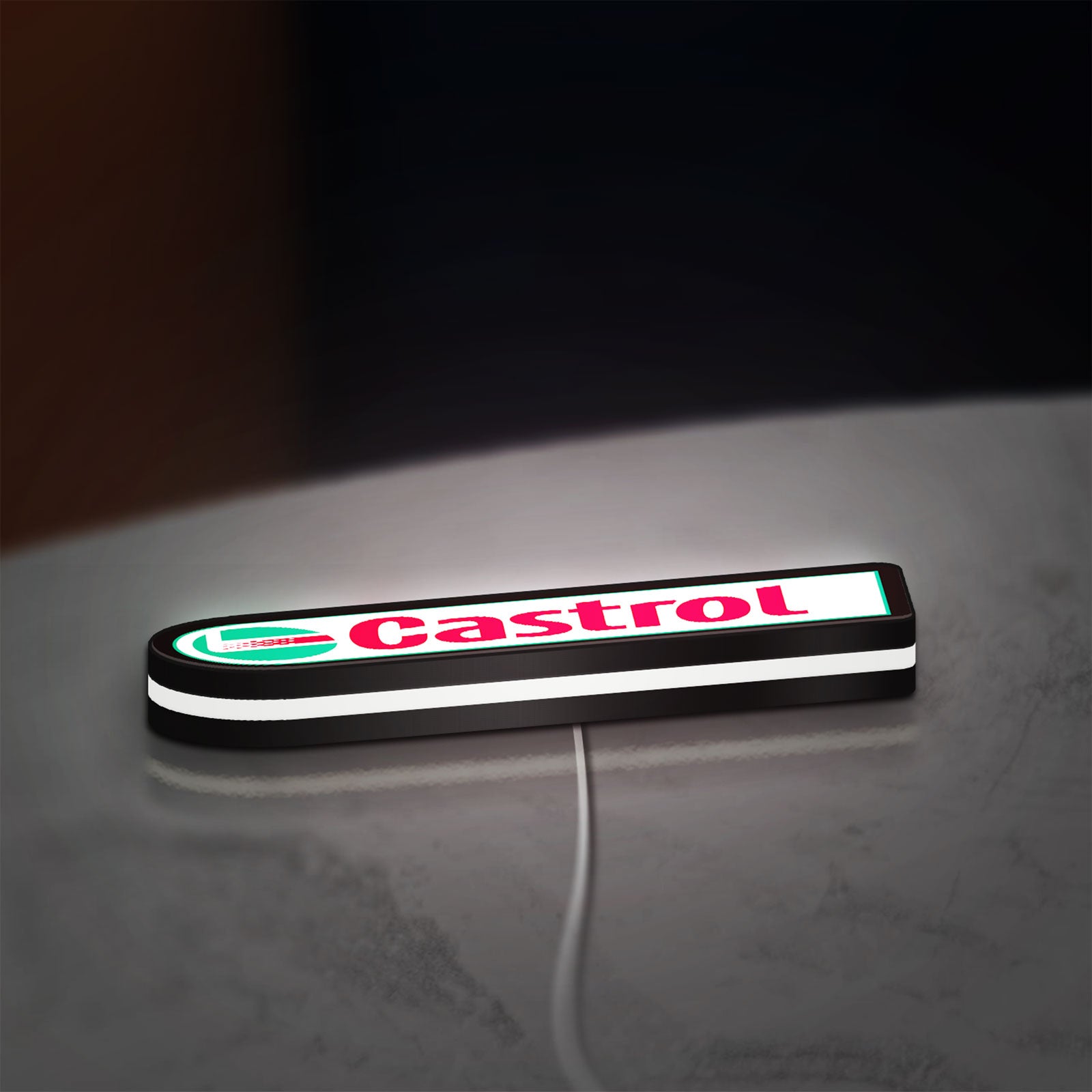 Castrol LED lightbox lying flat on a desk with white glow