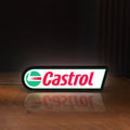 Front view of Castrol LED lightbox sign glowing on a wooden desk