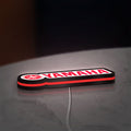 Yamaha LED lightbox lying flat on a desk with red glow