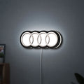 Audi LED lightbox hanging on a wall with white glow