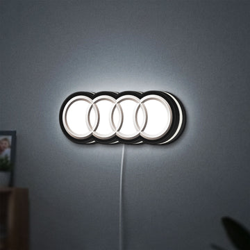 Audi LED lightbox hanging on a wall with white glow