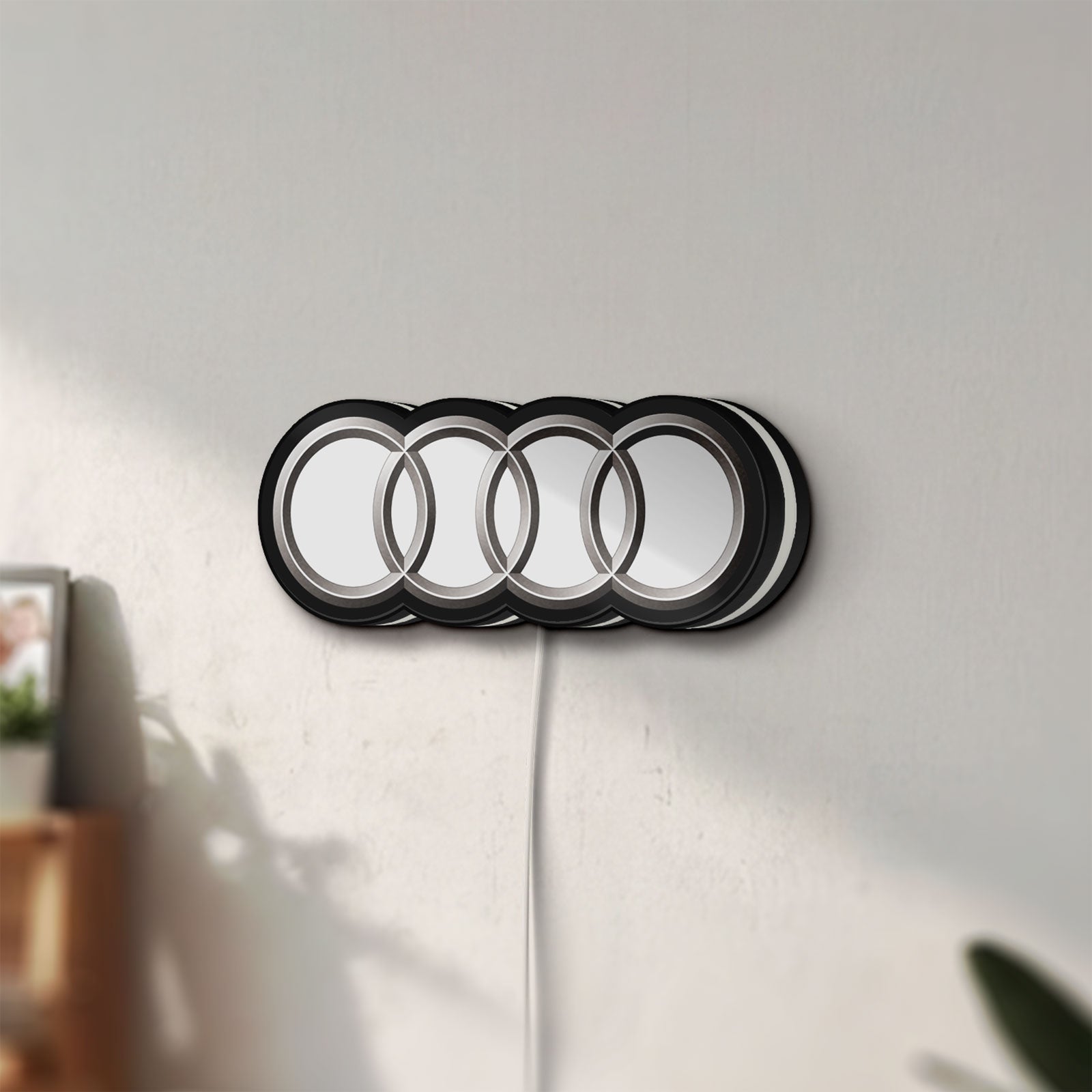 Unlit Audi LED lightbox mounted on a wall in daylight