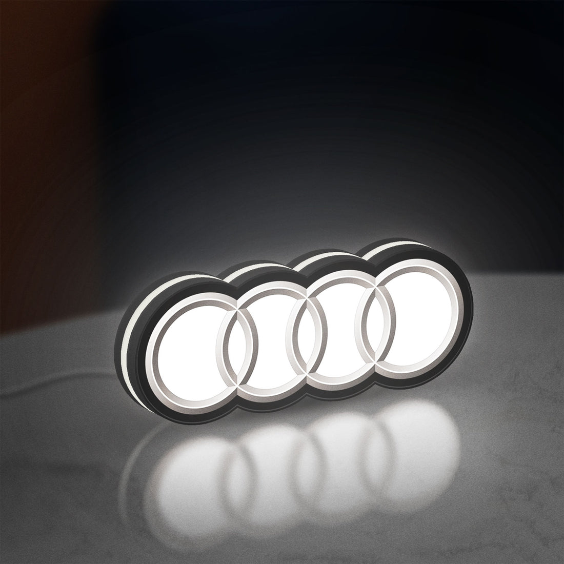 Audi LED lightbox hanging on a wall with white glow
