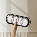Unlit Audi LED lightbox held by hand to show size and details