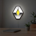 Renault LED lightbox hanging on a room wall with soft yellow light