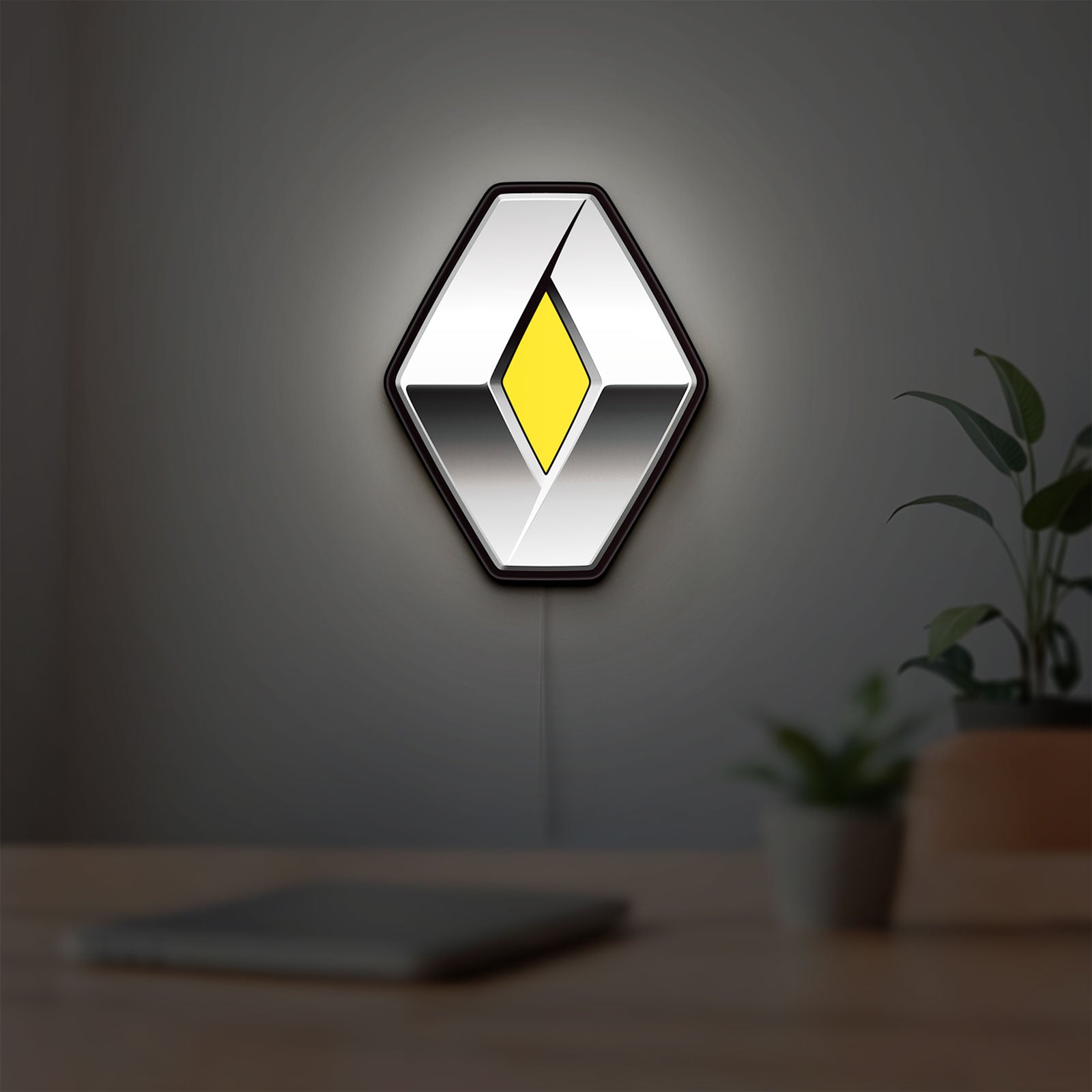 Renault LED lightbox hanging on a room wall with soft yellow light