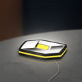 Renault LED lightbox lying flat on a desk with yellow glow
